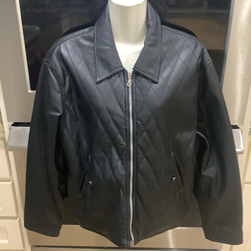 Faux leather jacket. Size large. Sleeves can roll up if needed. 2 front pockets.